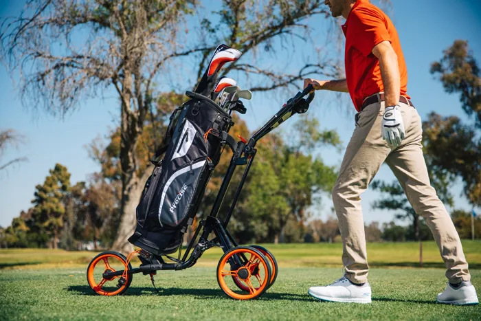 Precise Qwik Fold 3-wheel golf push cart on a golf course